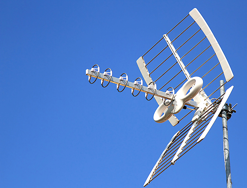 Antenna TV aerial for reception of TV channels and the blue sky